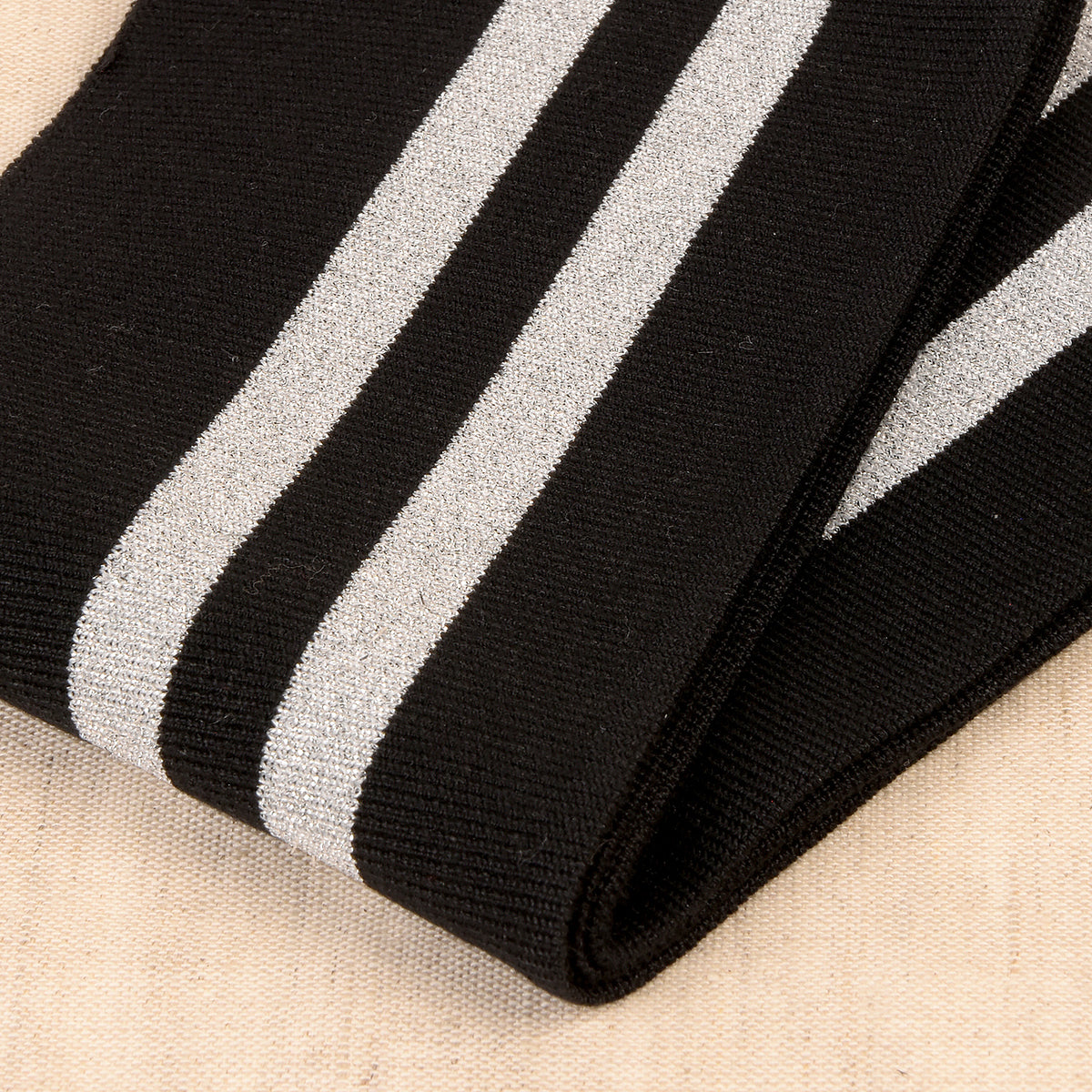 Black cuff and waistband trim with silver metallic stripes
