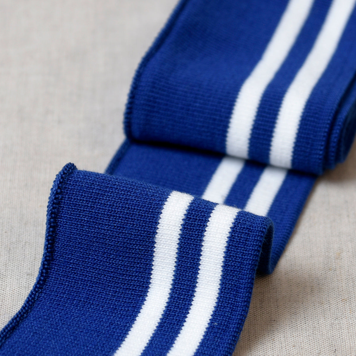Royal blue and white striped cuff and waist ribbing trim