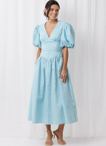 Simplicity S3096 sewing pattern envelope showing a wrap V-neck dress with pockets