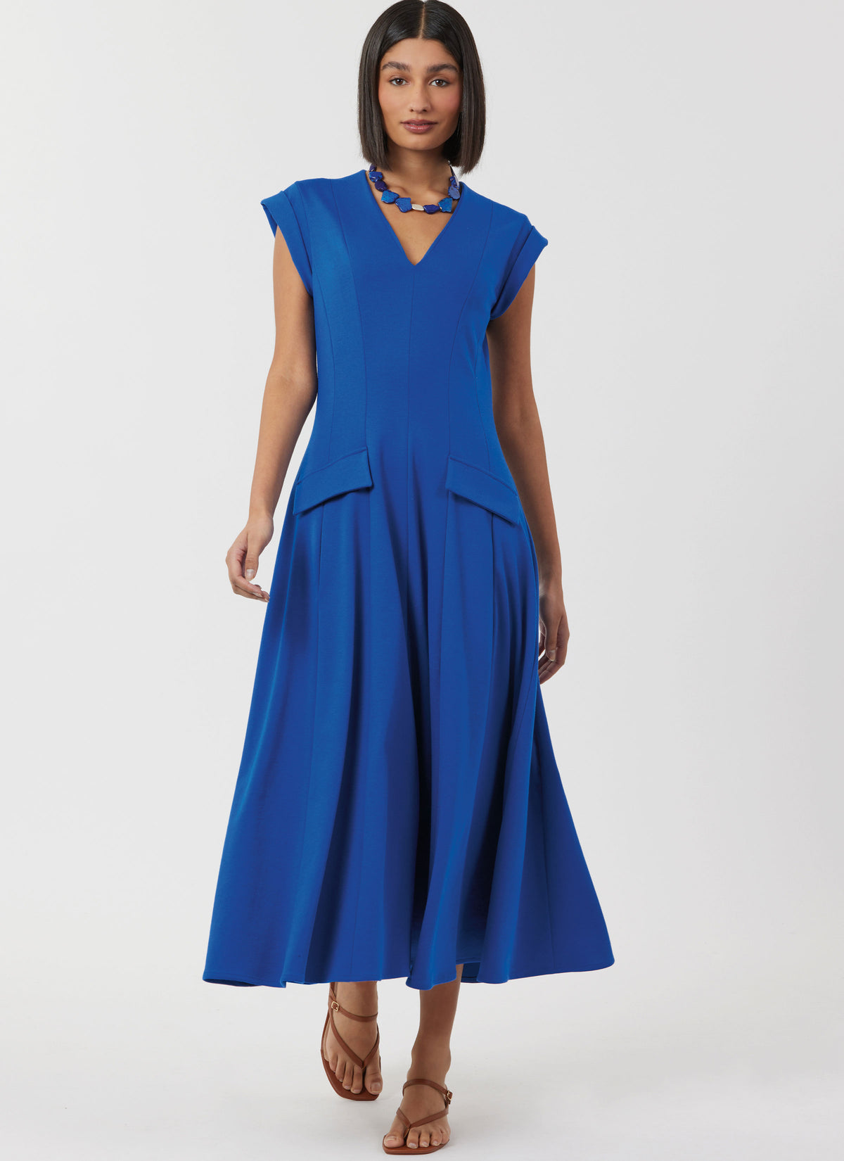 Simplicity S3097 sewing pattern envelope showing a V-neck dress with pockets