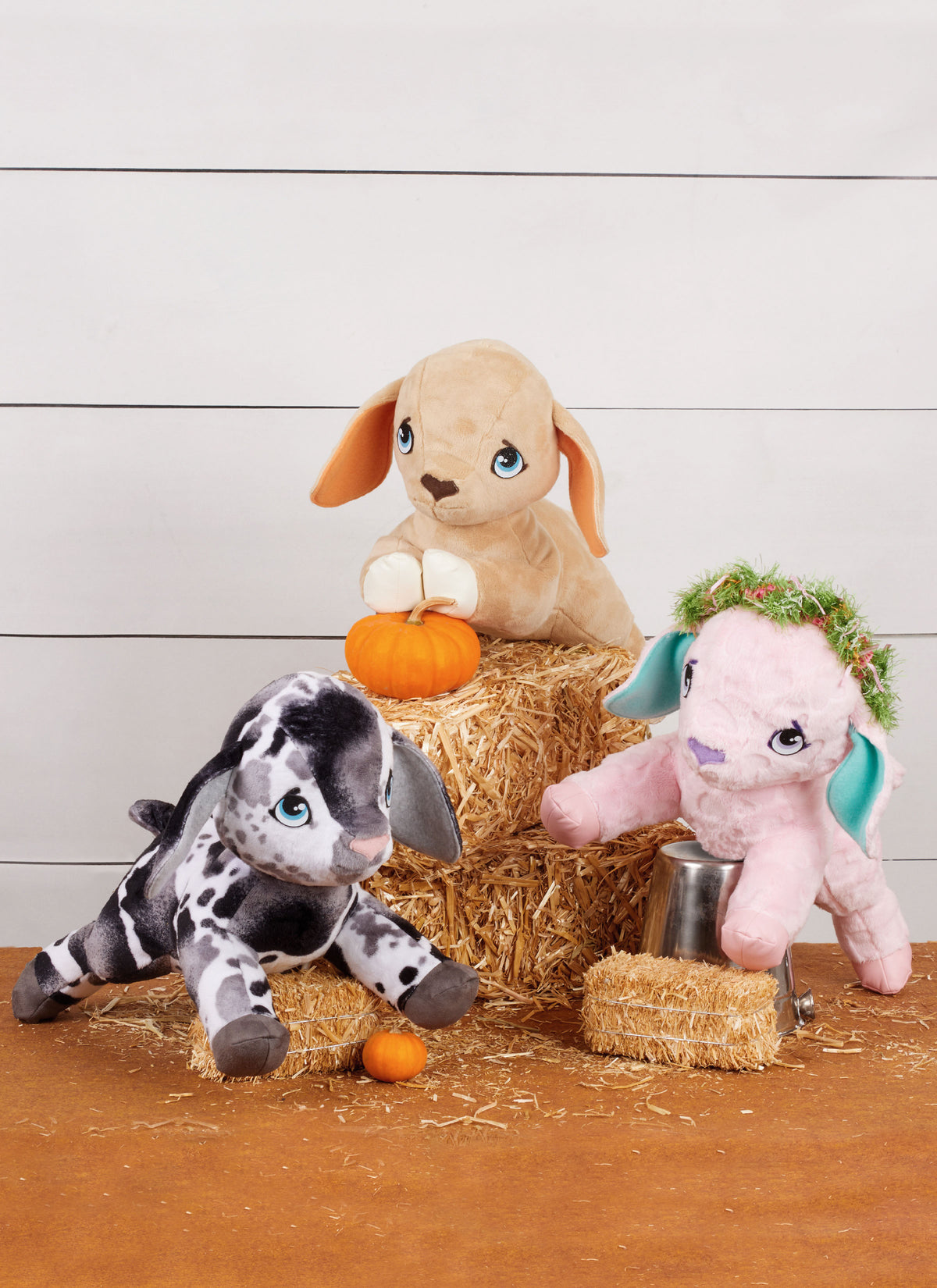 Simplicity S3121 pattern envelope showing three plush animal soft toys with floppy ears on hay bales