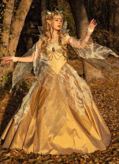 Simplicity S3160 pattern envelope showing a gold fantasy gown with sheer leaf overlays