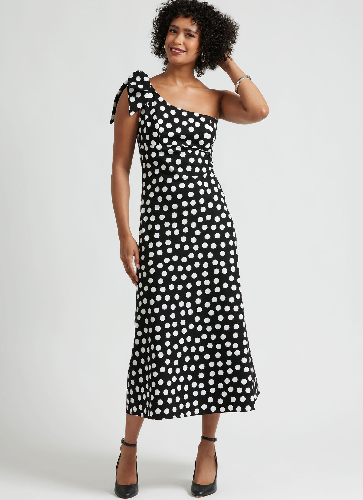 Simplicity S3165 pattern envelope showing a one-shoulder dress in three lengths