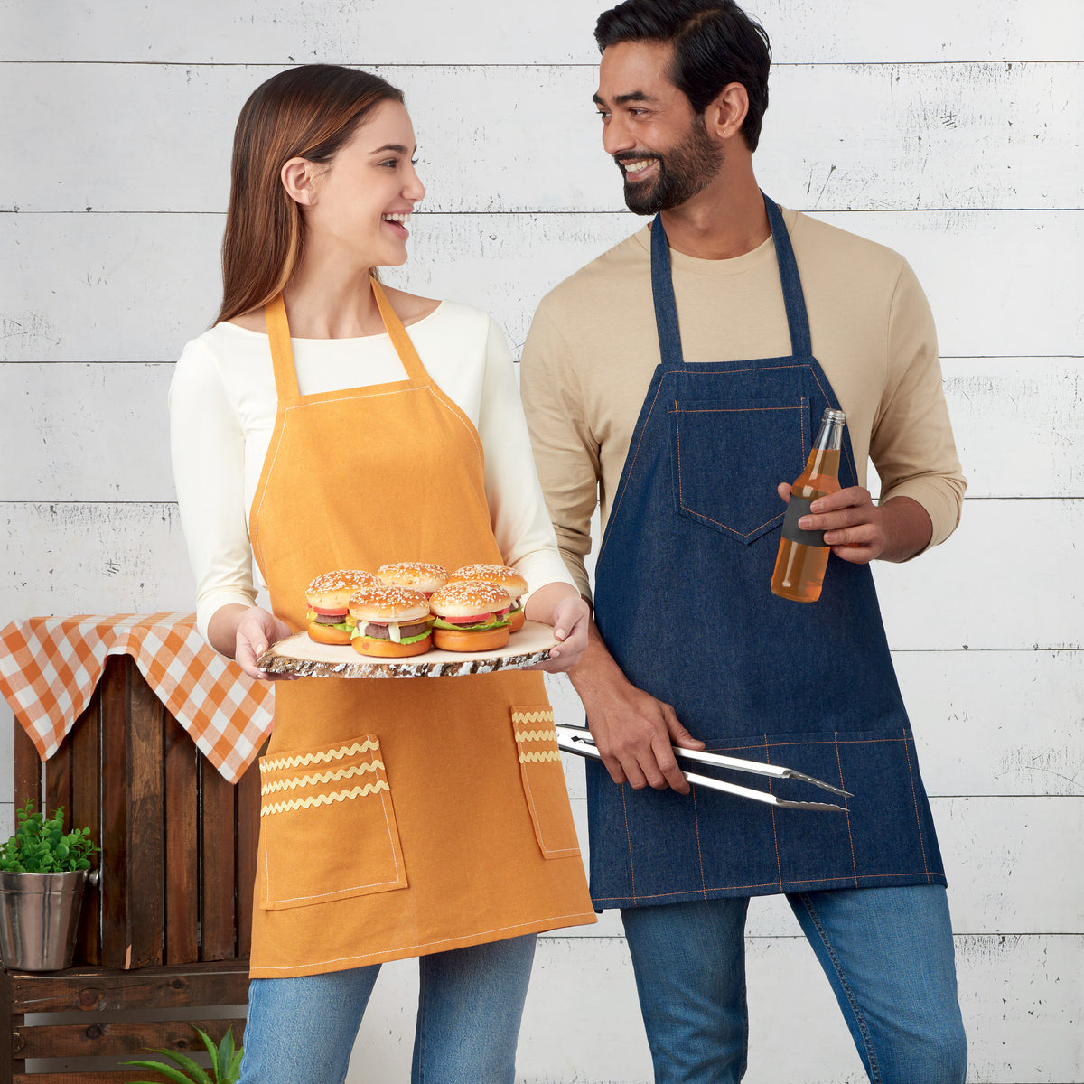 Simplicity S9302 sewing pattern envelope showing unisex bbq apron designs
