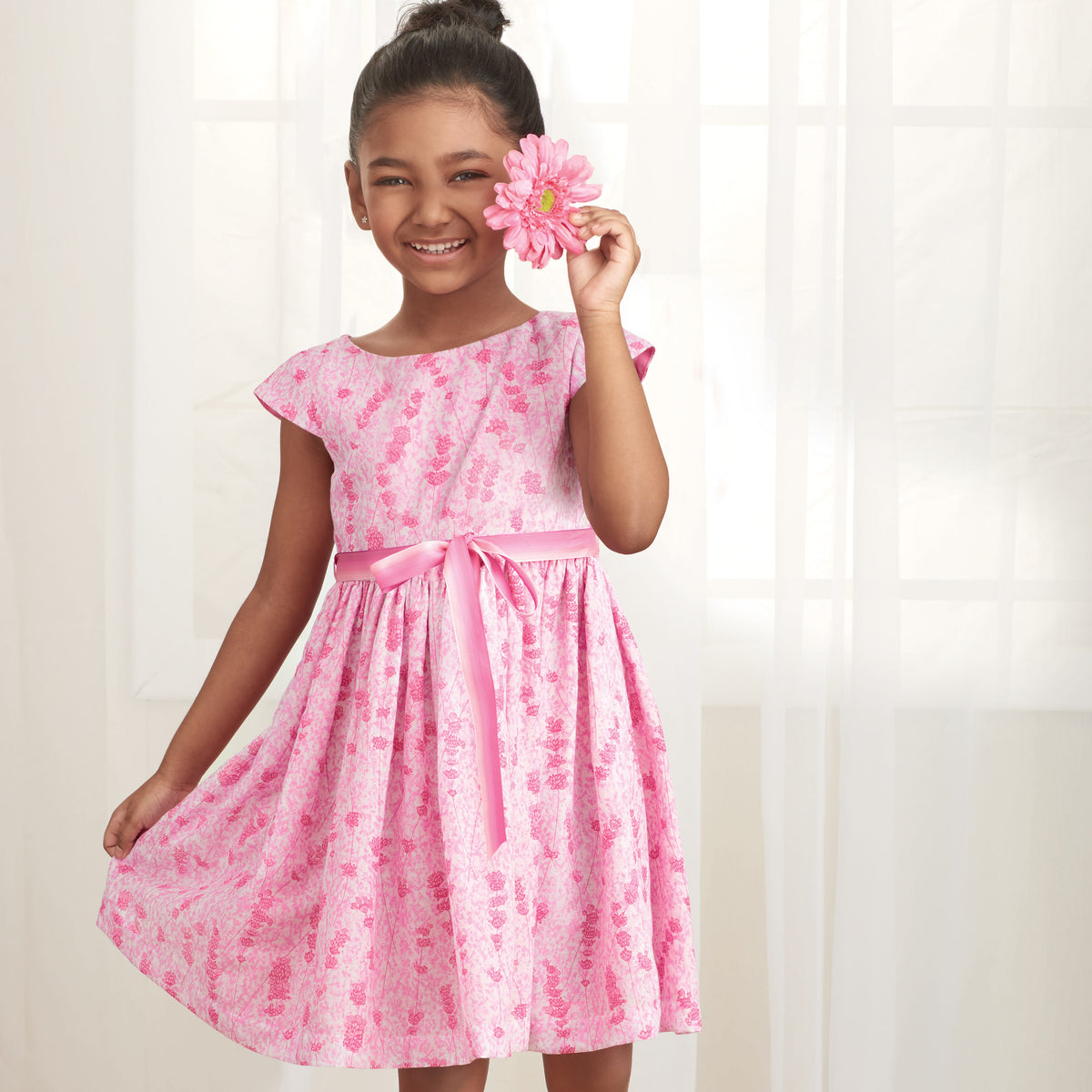 Simplicity S9320 sewing pattern envelope showing child's dress designs