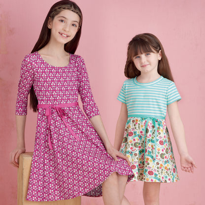 Simplicity S9322 sewing pattern envelope showing girls' dress designs