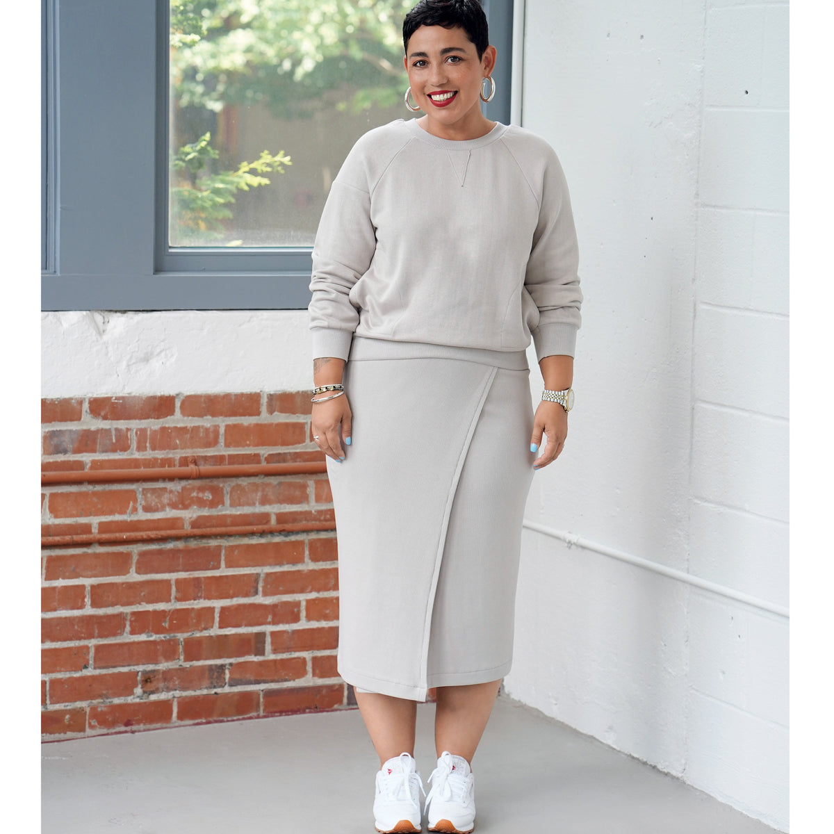 Simplicity S9450 sewing pattern envelope showing women's casual top and wrap skirt