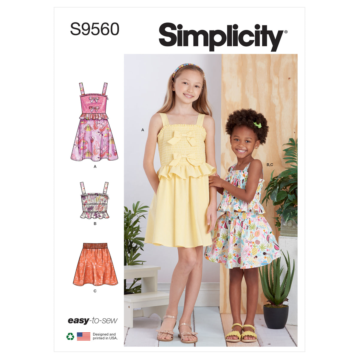 Simplicity S9560 pattern envelope showing girls' tops with ruffle peplums
