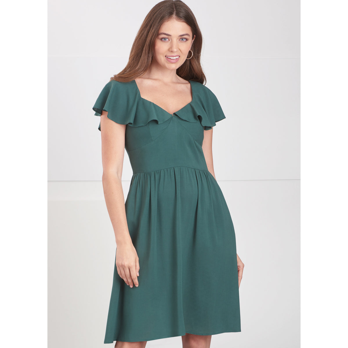 Simplicity S9703 sewing pattern envelope showing V-neck flounce dress