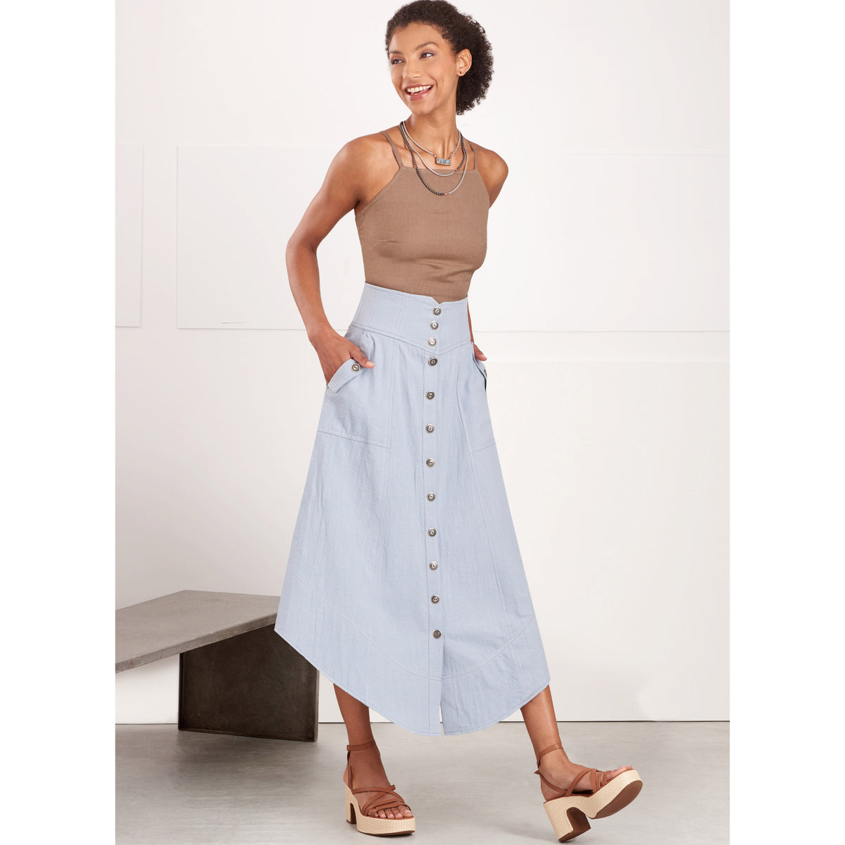 Simplicity S9710 sewing pattern envelope showing yoked skirts and trousers
