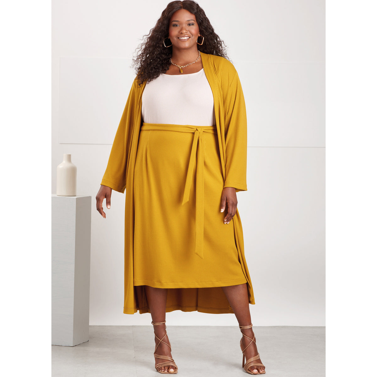 Simplicity S9717 sewing pattern envelope showing knit top, cardigan and skirt