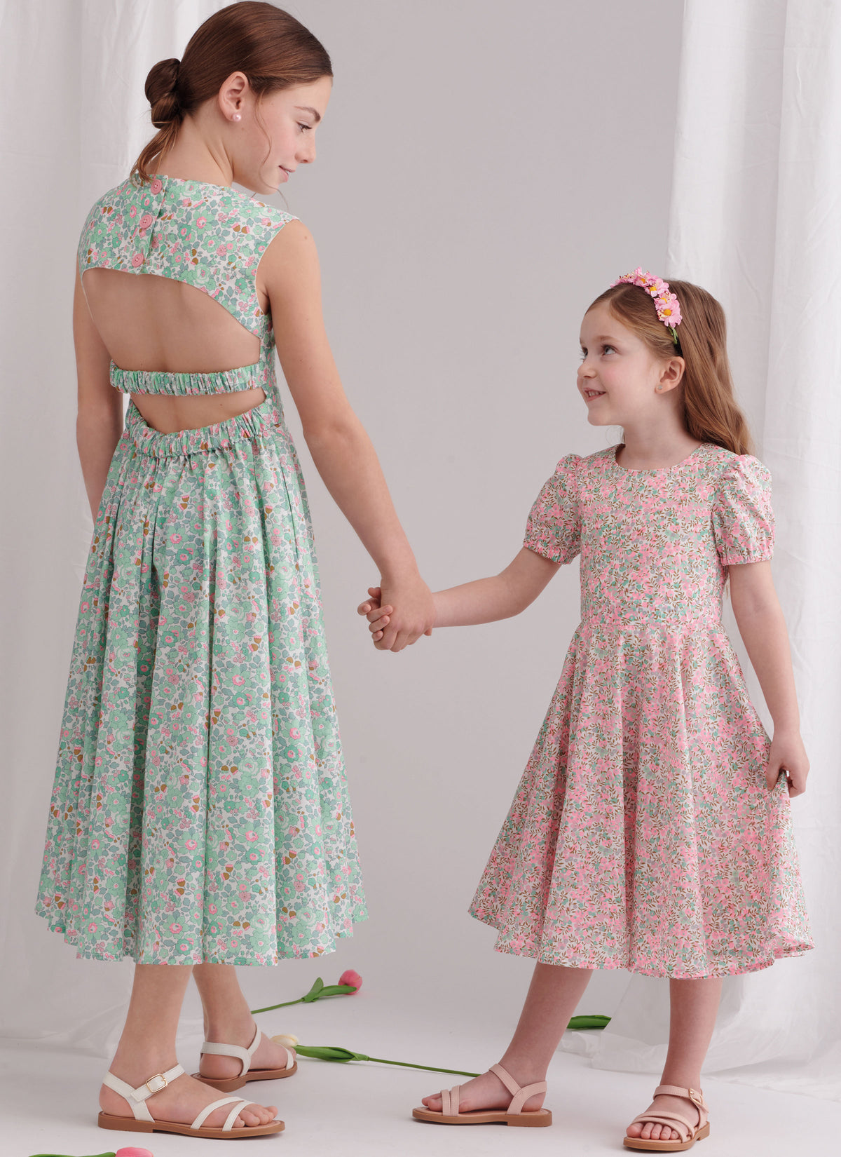 Simplicity sewing pattern S9799 envelope showing children's and girls' party dress designs