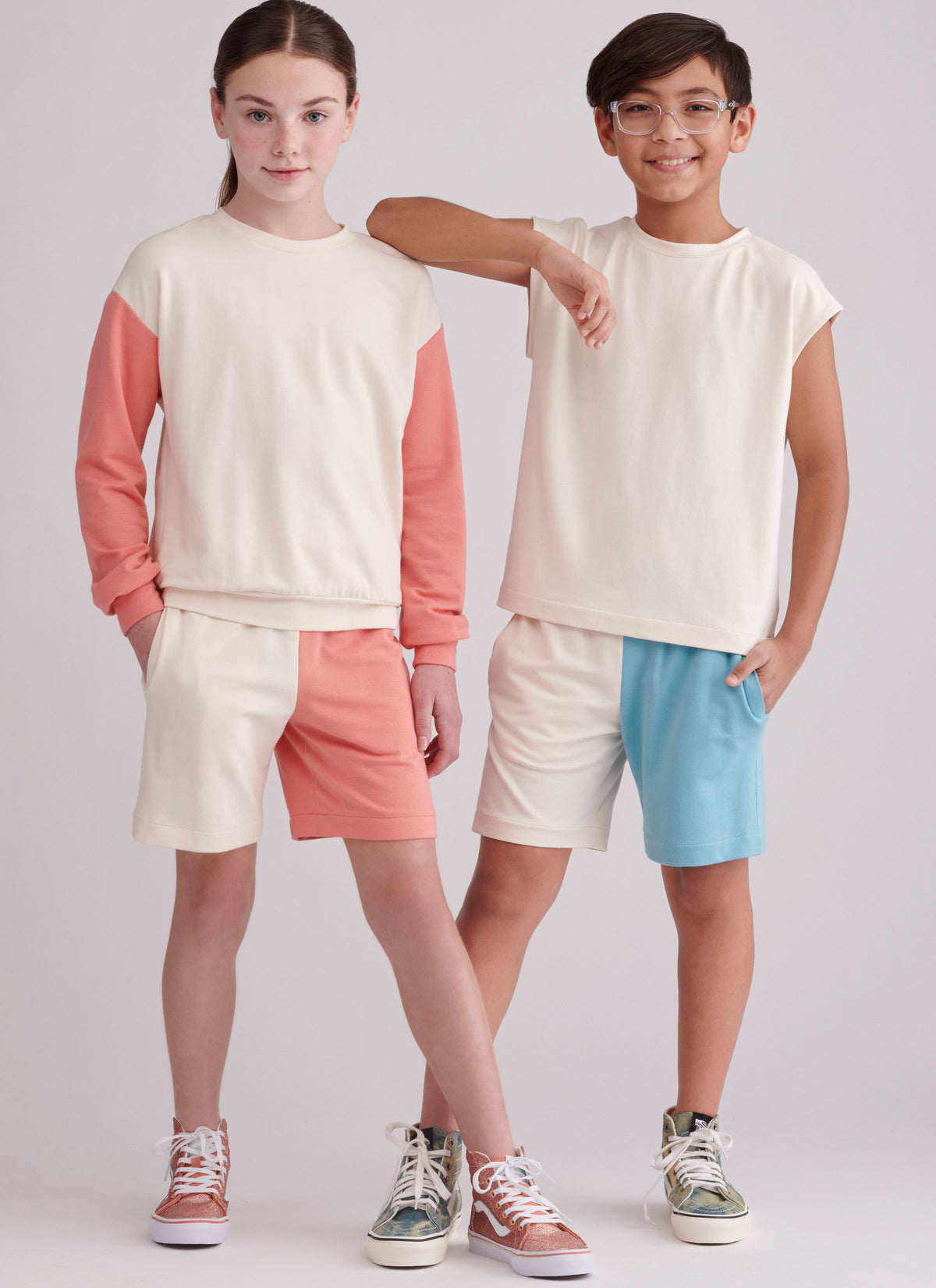 Simplicity sewing pattern S9801 envelope showing girls' and boys' sweatshirt and shorts designs