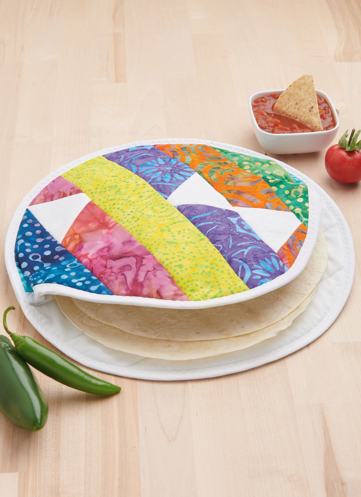 Simplicity S9942 sewing pattern envelope showing an apron and quilted kitchen accessories