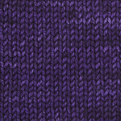 Skein of Symfonie Bella semi-solid merino yarn in Java Plum