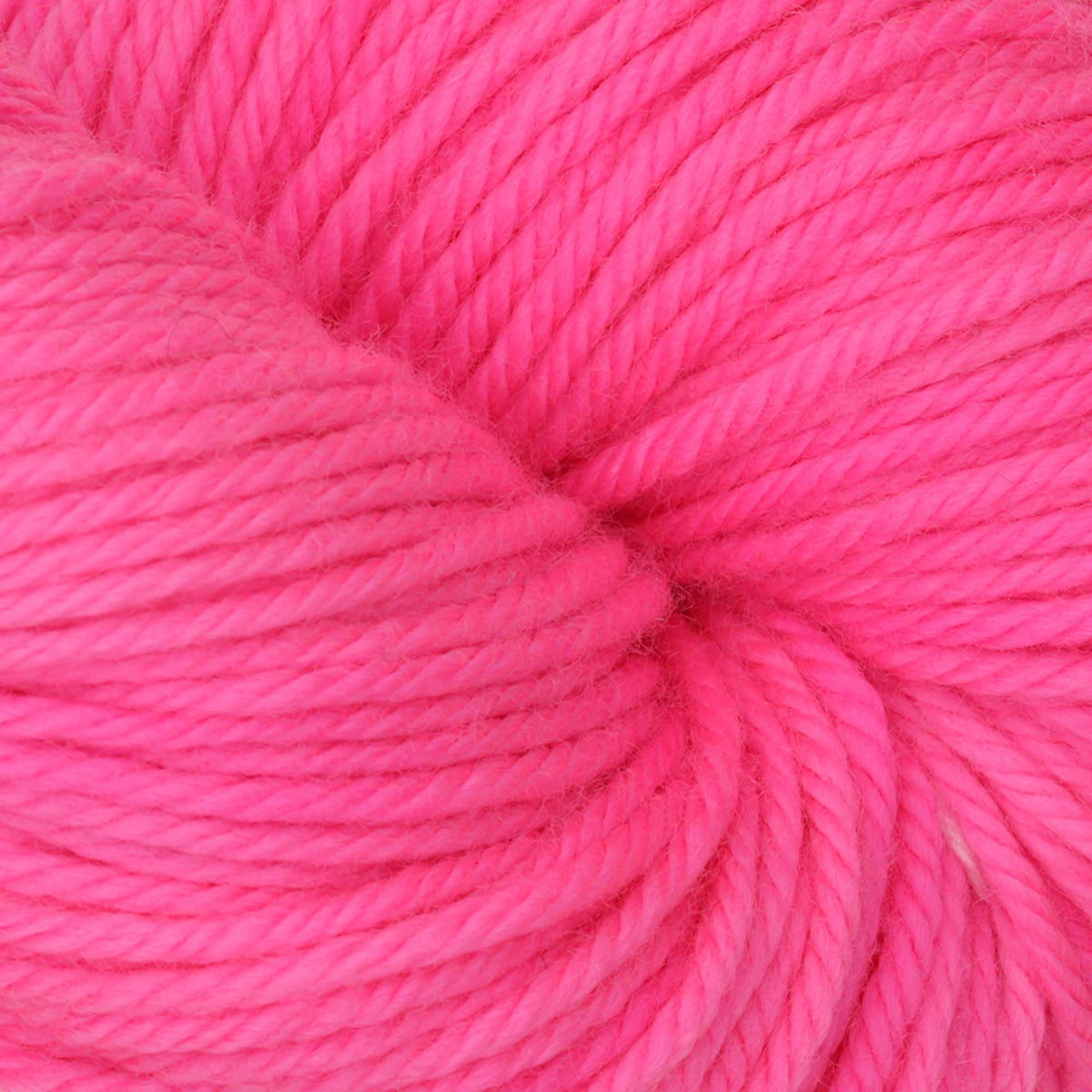 Skein of Symfonie Bella semi-solid merino yarn in Ka-Pow Pink