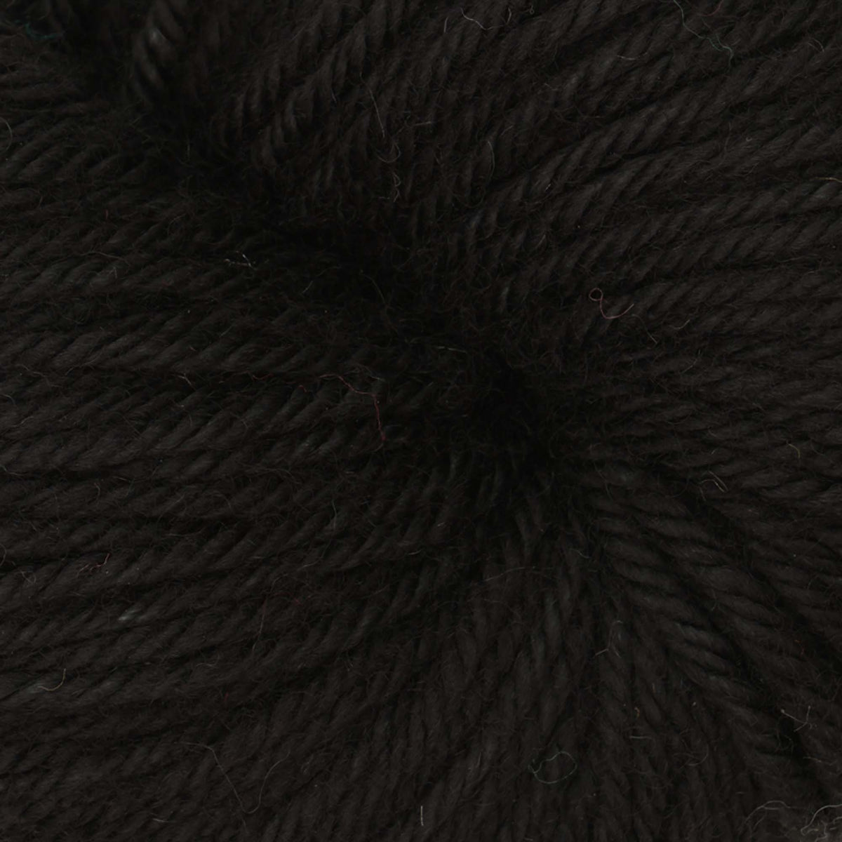 Skein of Symfonie Bella semi-solid merino yarn in Jet Black