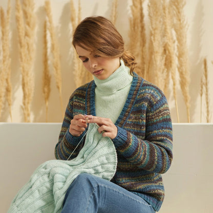 Hand-dyed skein of Symfonie Bella yarn in Riverbank