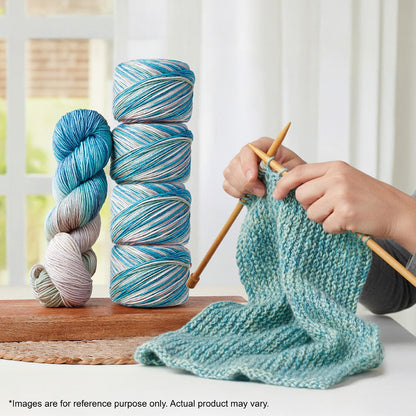 Hand-dyed skein of Symfonie Bella yarn in Sandy Sea
