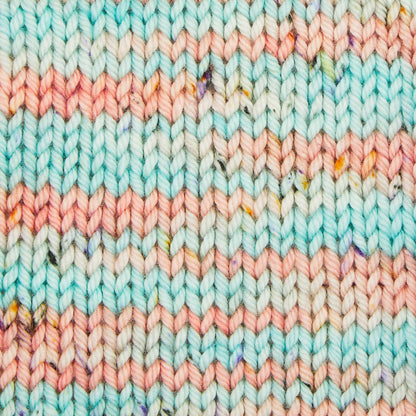 Skein of Symfonie Bella variegated merino yarn in Bonnie Blooms