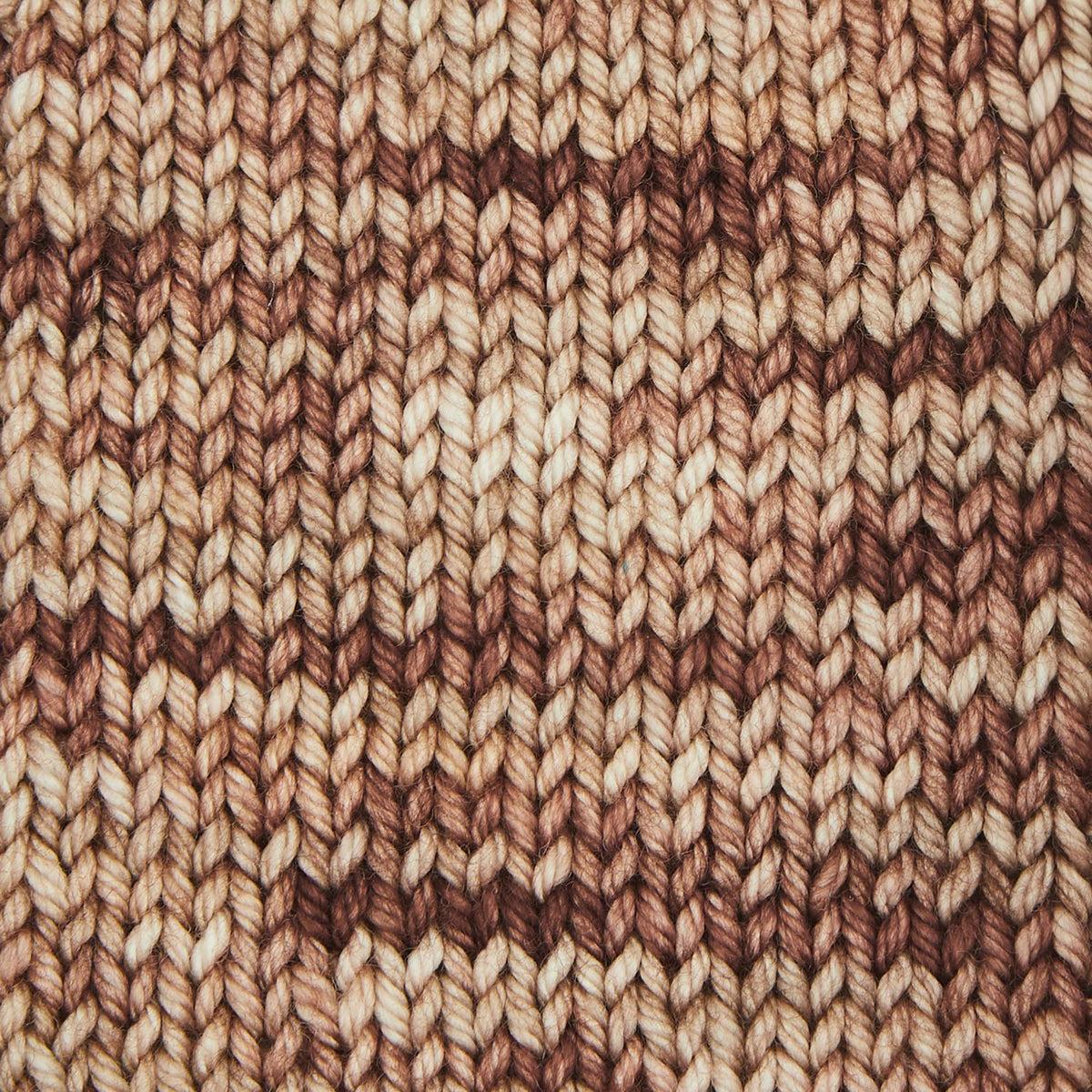 Skein of Symfonie Bella variegated merino yarn in Mocha