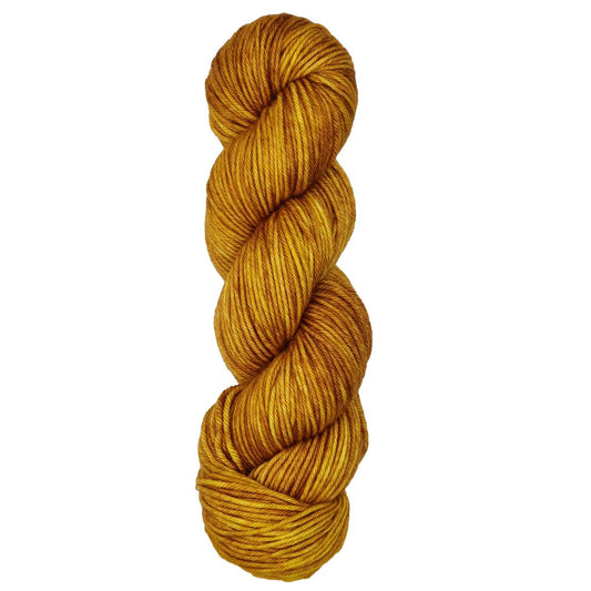 Skein of Symfonie Bella variegated merino yarn in Gold Leaf
