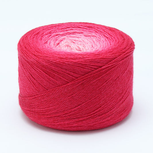 Hand-dyed cake of Symfonie Diva yarn in Cherry Blossom