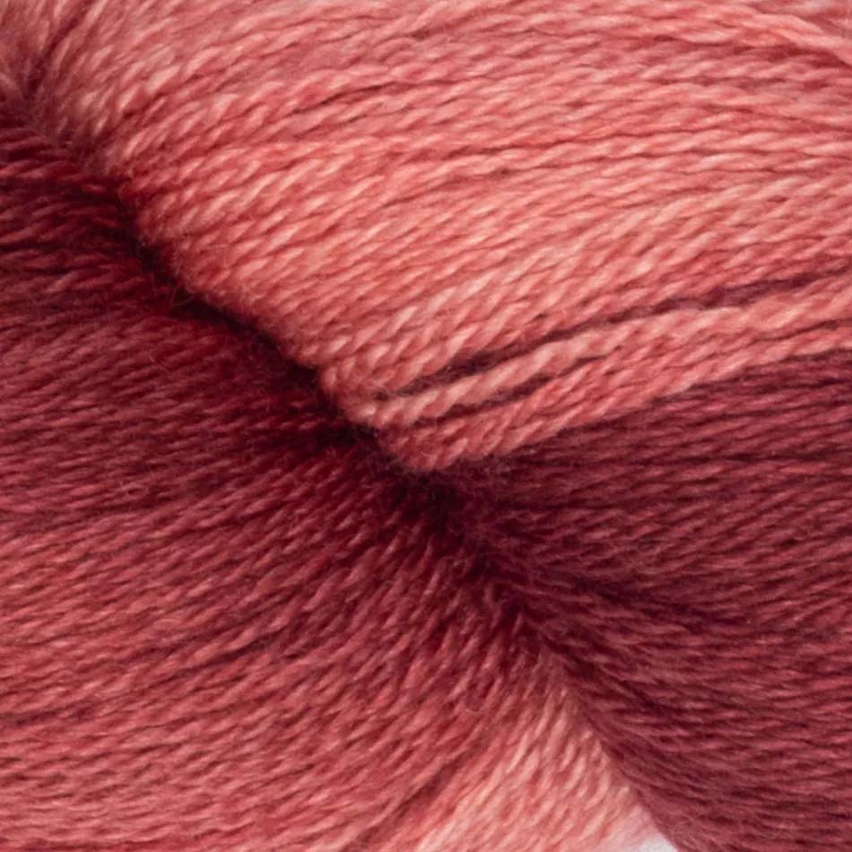 Hand-dyed cake of Symfonie Diva yarn in Winewash