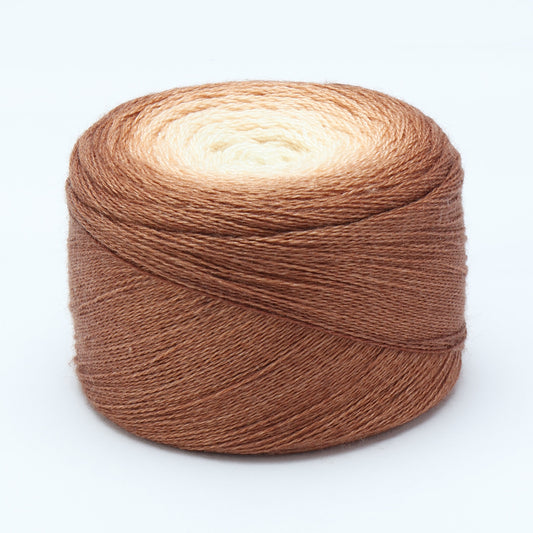 Hand-dyed cake of Symfonie Diva yarn in Soil to Sand