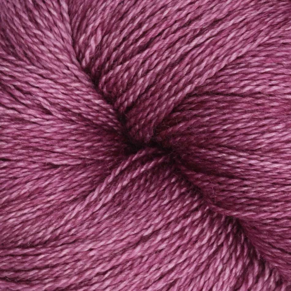 Hand-dyed cake of Symfonie Diva yarn in Amethyst Dust