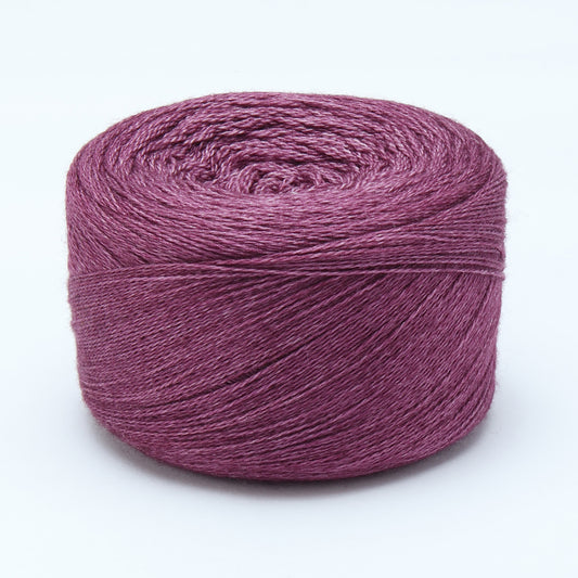 Hand-dyed cake of Symfonie Diva yarn in Amethyst Dust
