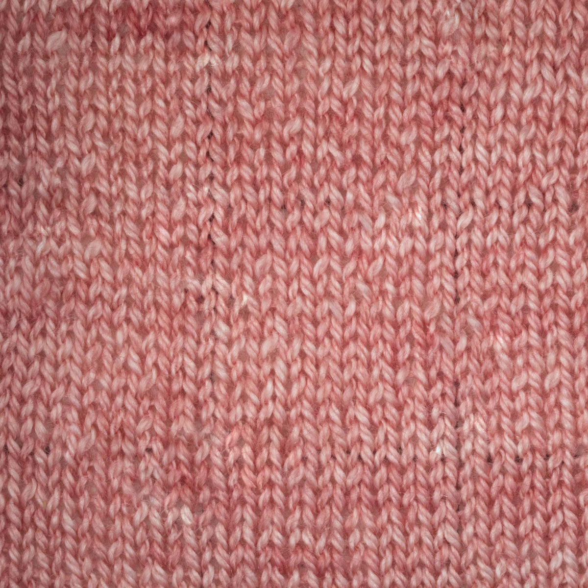 Hand-dyed cake of Symfonie Diva yarn in Rose Copper