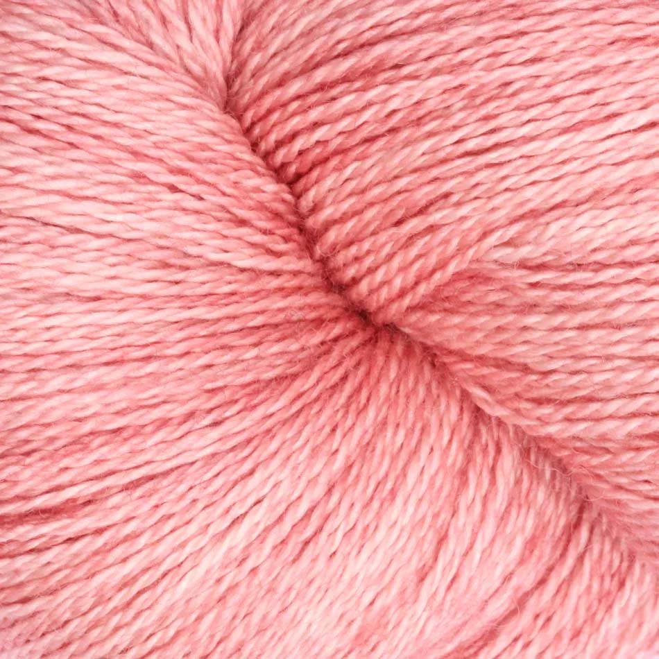 Hand-dyed cake of Symfonie Diva yarn in Rose Copper