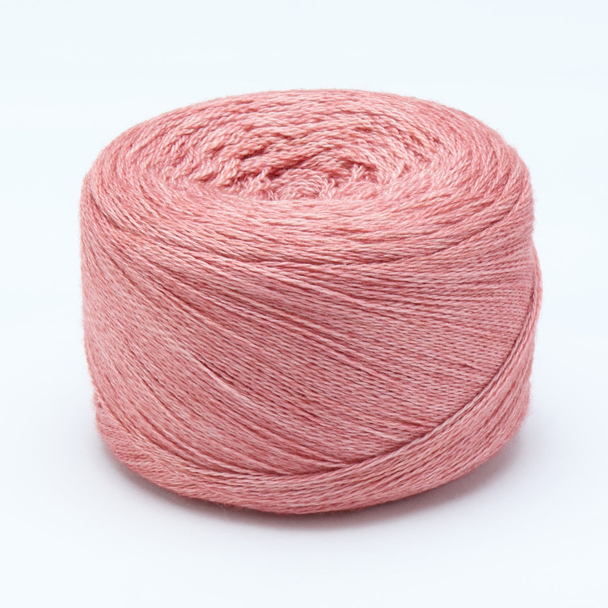Hand-dyed cake of Symfonie Diva yarn in Rose Copper