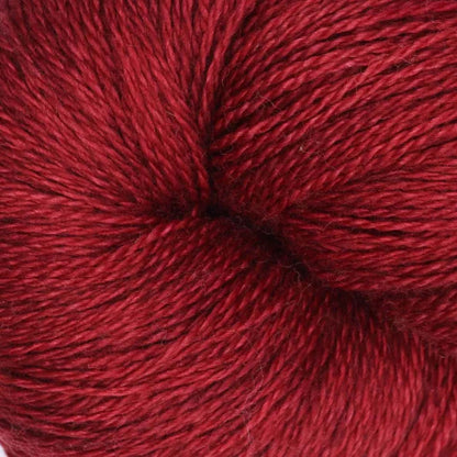 Hand-dyed cake of Symfonie Diva yarn in Red Fall
