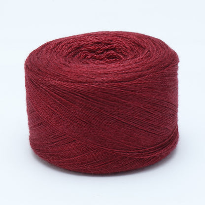 Hand-dyed cake of Symfonie Diva yarn in Red Fall