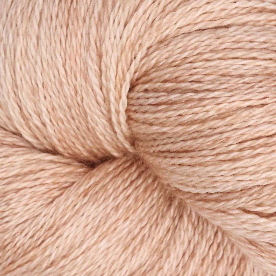 Hand-dyed cake of Symfonie Diva yarn in Champagne