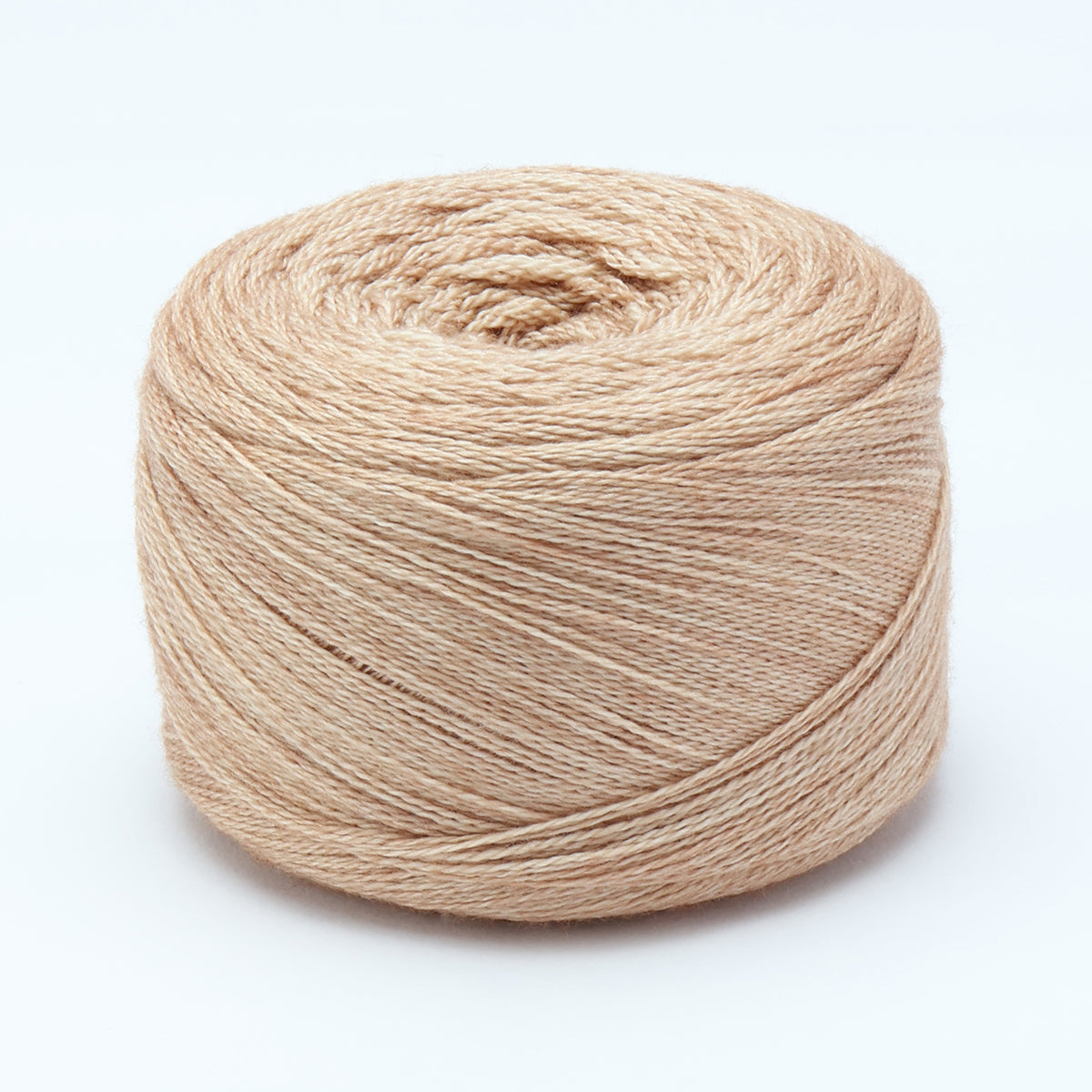 Hand-dyed cake of Symfonie Diva yarn in Champagne