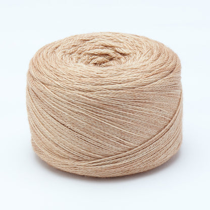 Hand-dyed cake of Symfonie Diva yarn in Champagne