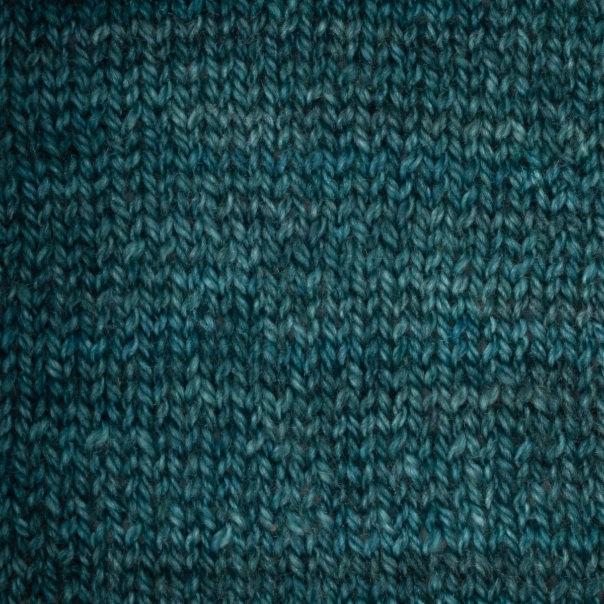 Hand-dyed cake of Symfonie Diva yarn in Mermaid Teal