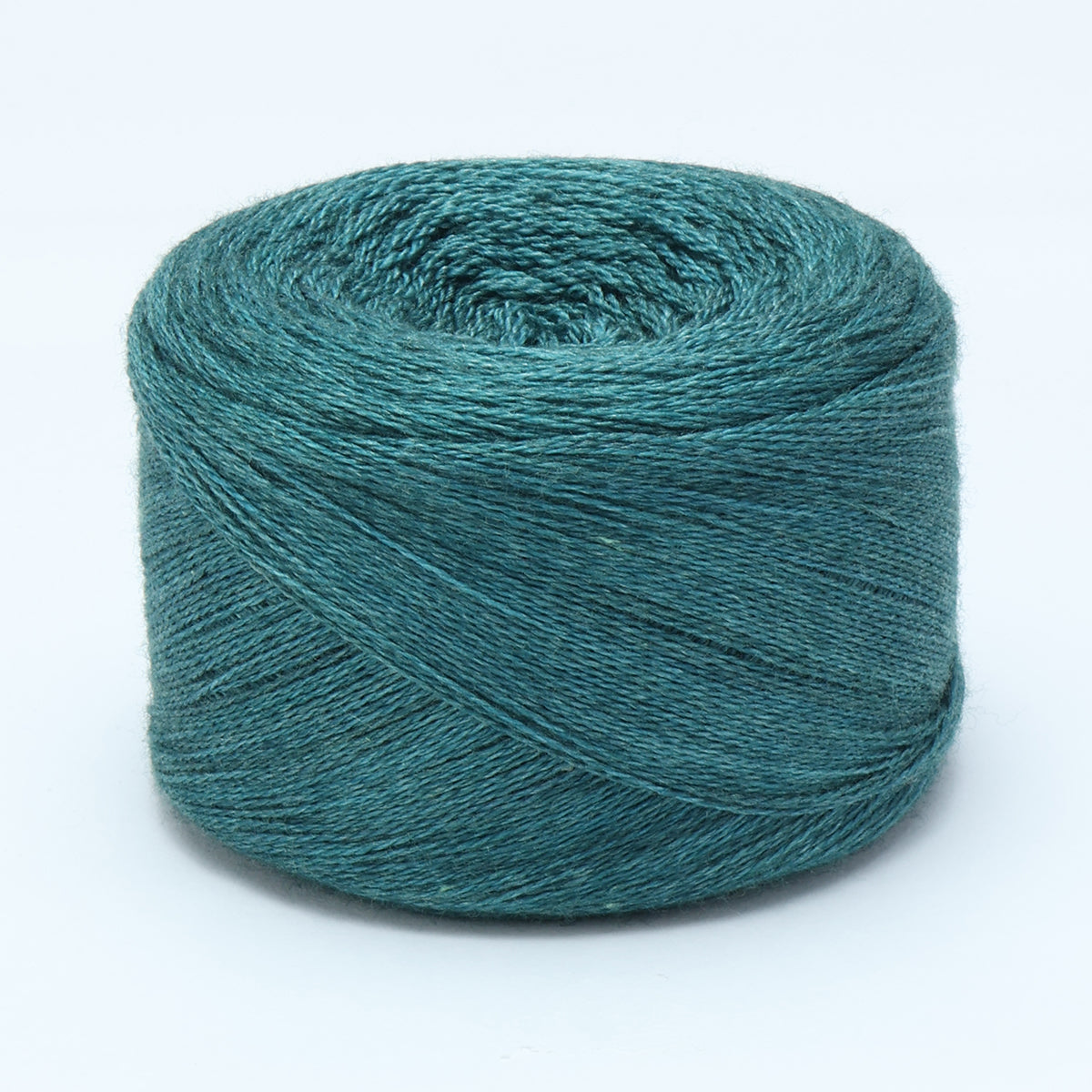 Hand-dyed cake of Symfonie Diva yarn in Mermaid Teal