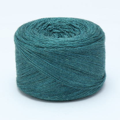 Hand-dyed cake of Symfonie Diva yarn in Mermaid Teal