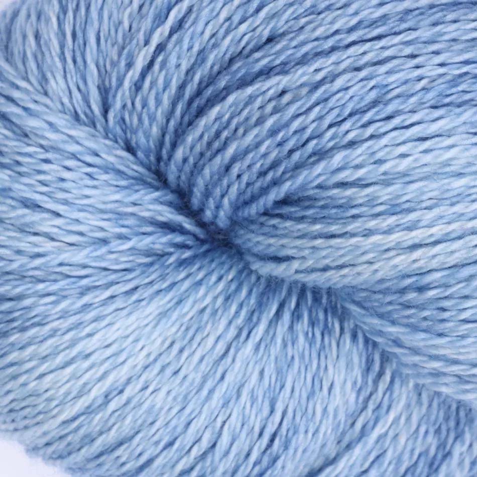 Hand-dyed cake of Symfonie Diva yarn in Blue Topaz