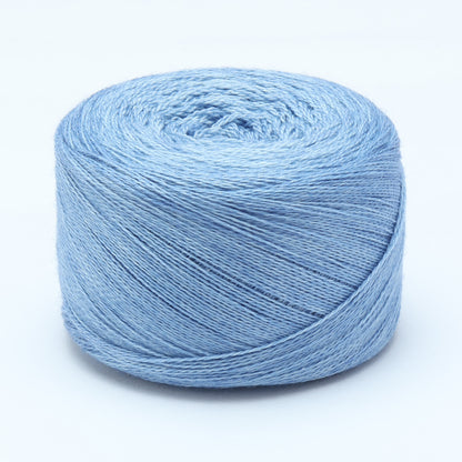 Hand-dyed cake of Symfonie Diva yarn in Blue Topaz