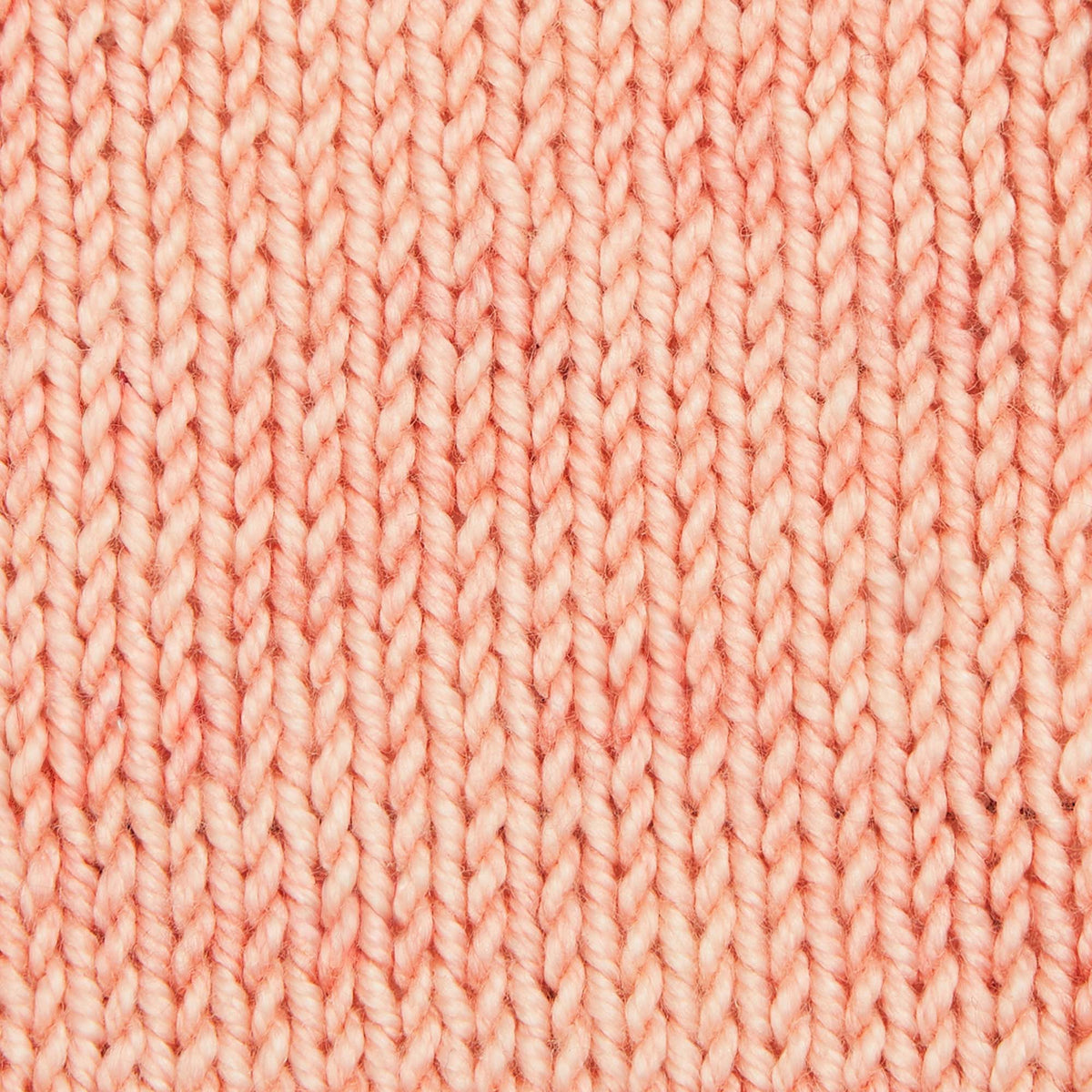 Hand-dyed skein of Symfonie Luna yarn in Coral Cloud