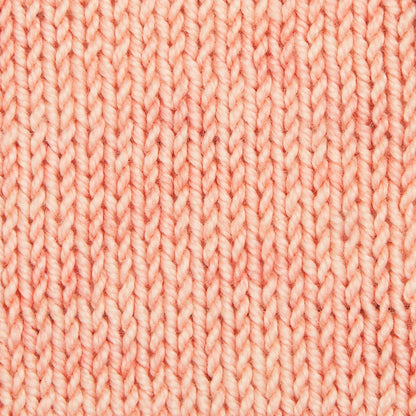 Hand-dyed skein of Symfonie Luna yarn in Coral Cloud