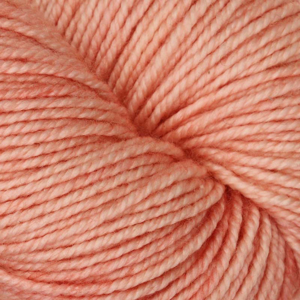 Hand-dyed skein of Symfonie Luna yarn in Coral Cloud
