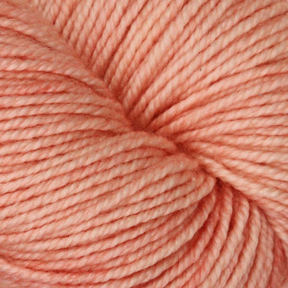 Hand-dyed skein of Symfonie Luna yarn in Coral Cloud