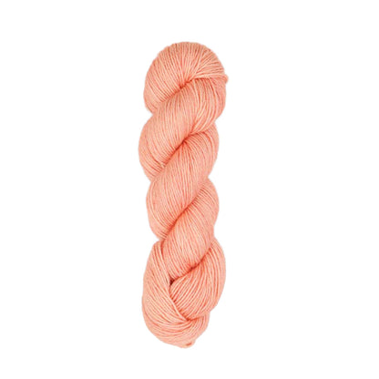 Hand-dyed skein of Symfonie Luna yarn in Coral Cloud