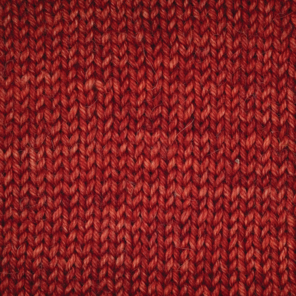 100g skein of Symfonie Serra yarn in Ember Red